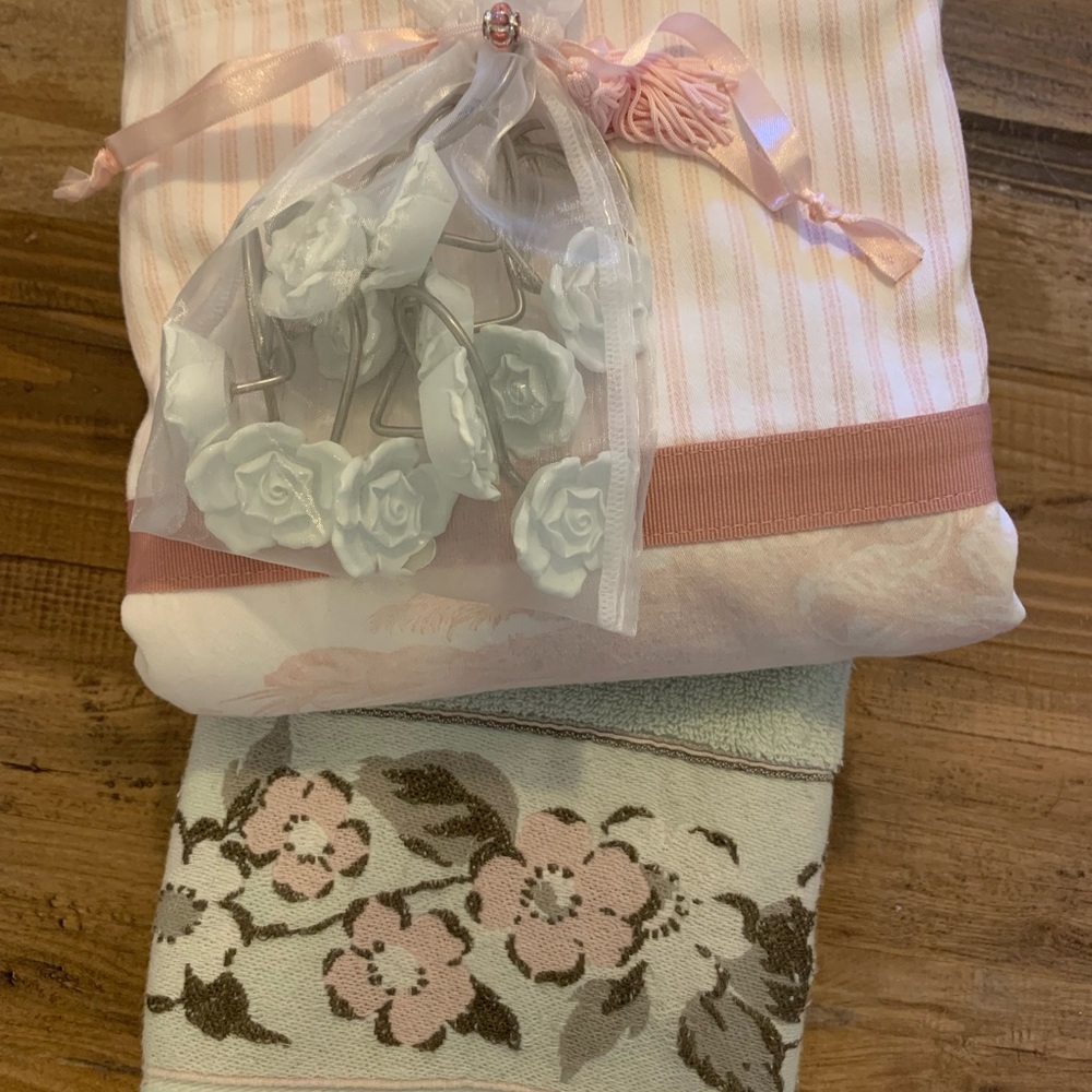 Shower curtain, hooks, and decorative towel.